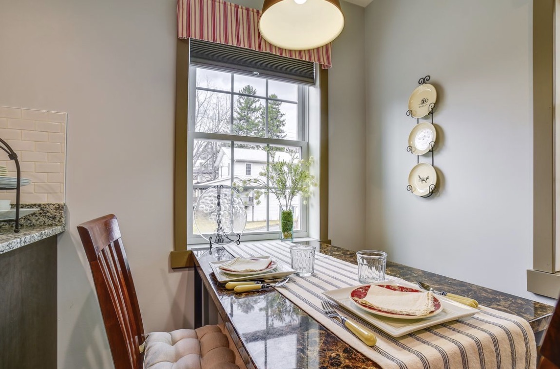 Guest house kitchen with granite counters, subway tile backsplash, dishwasher, coffee maker and electric kettle