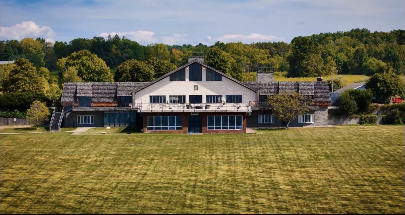 Diamond on Seneca property from the lawn — the main lodge with its second-floor overlook deck above Seneca Lake