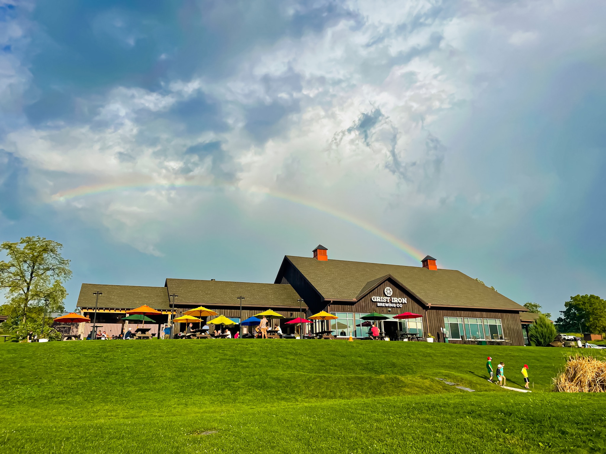 Grist Iron Brewing Company exterior with rainbow